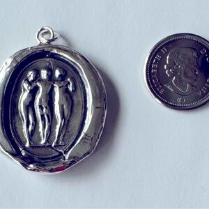 Pyrrha talisman pendant.